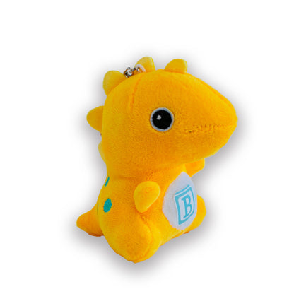 A collection of four plush dinosaur keychains in red, yellow, green, and blue, each with a 'B' logo on their chest.