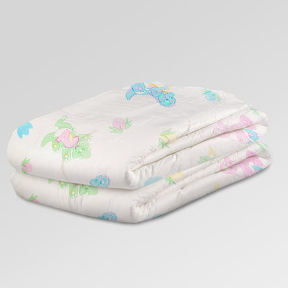 Bambino Magnifico all-over dino print adult diaper, stack of folded diapers
